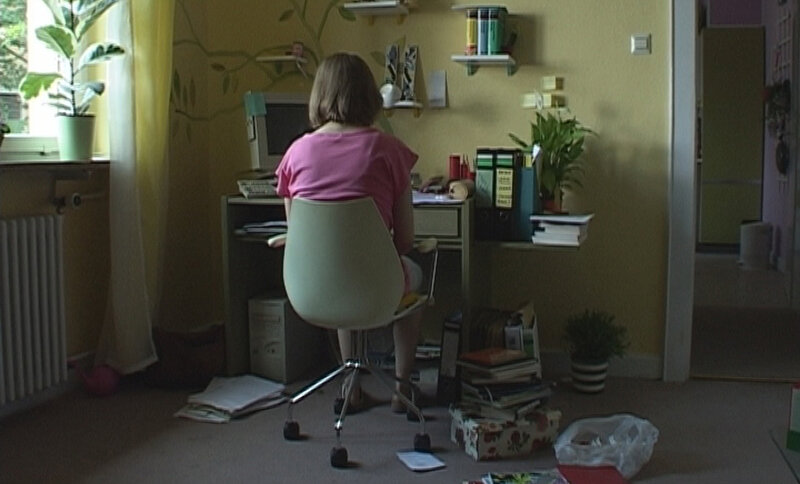 Person at Computer Desk — Yellow