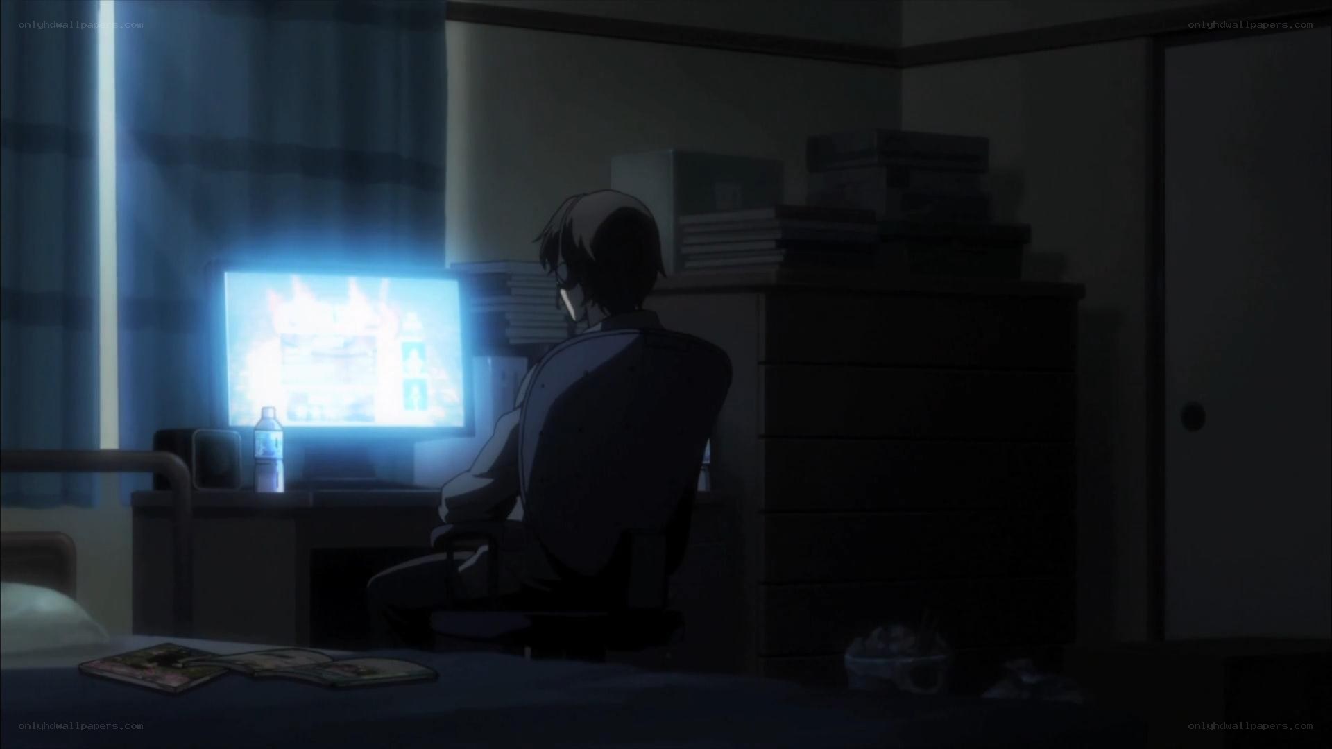 person at computer in dark room