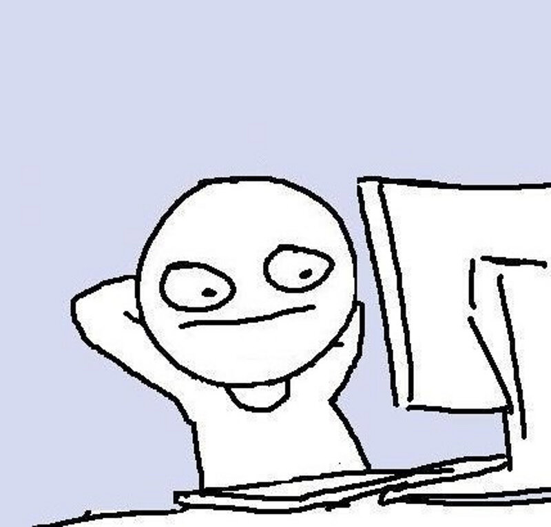 person at computer with bored expression