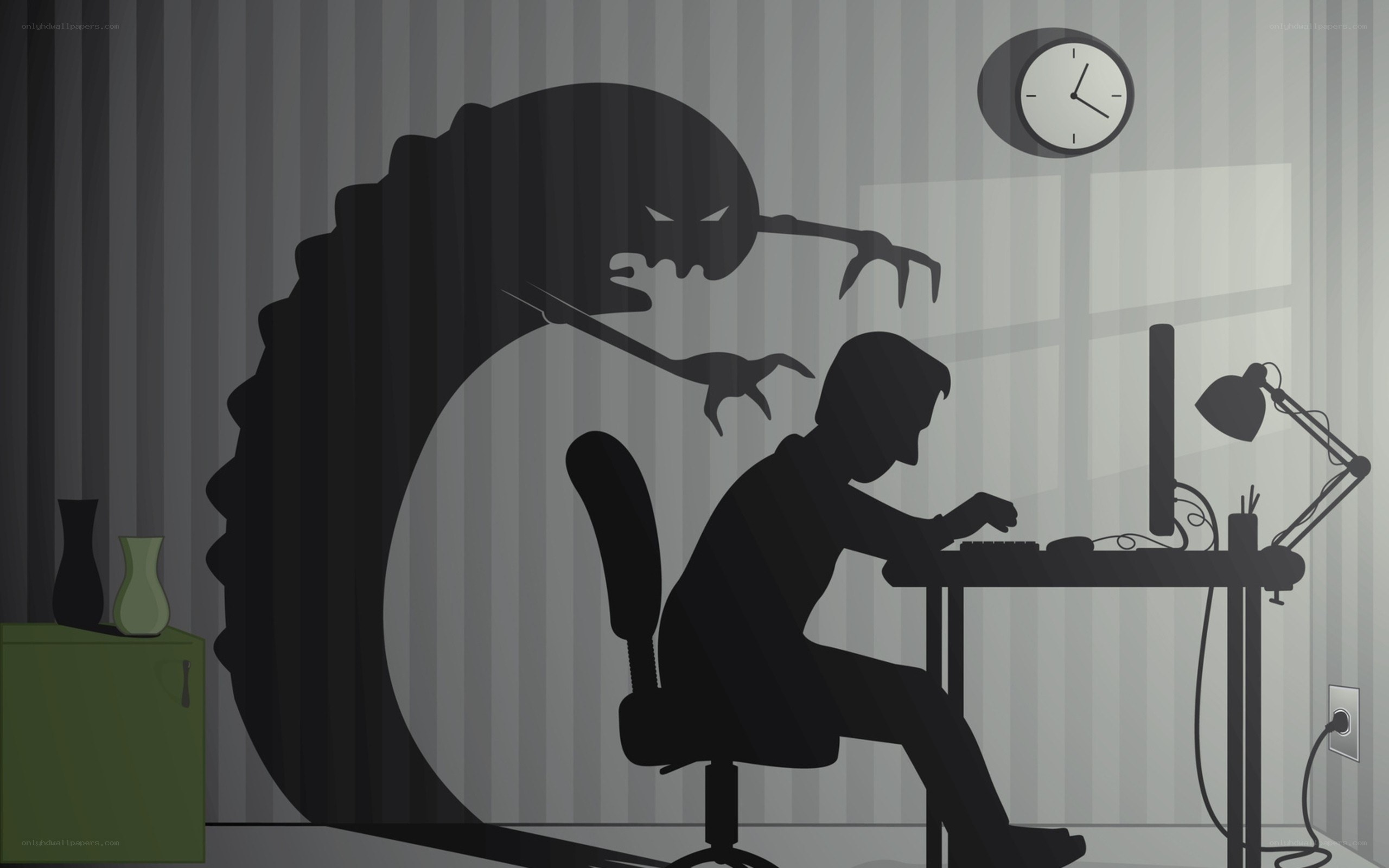 person at computer with shadow monster
