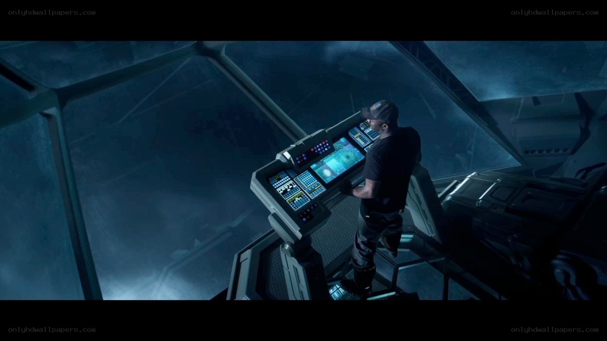 person at control panel in spaceship