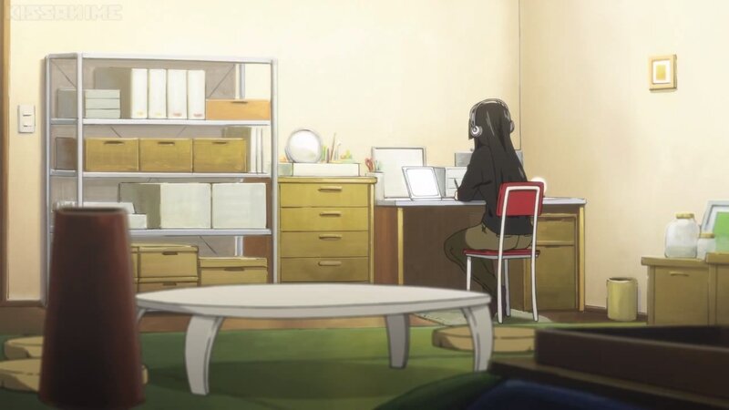 Person at Desk with Headphones