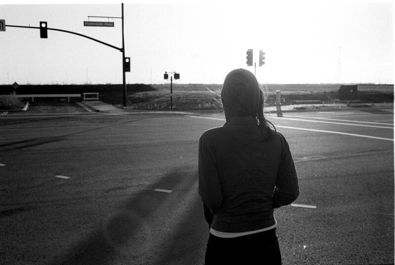 person at empty intersection