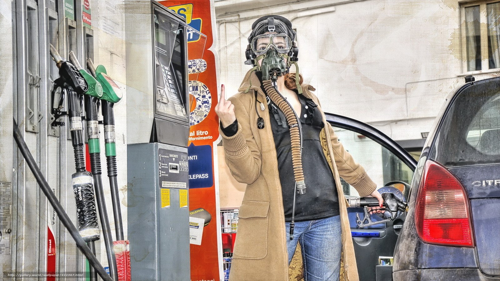 person at gas station with gas mask