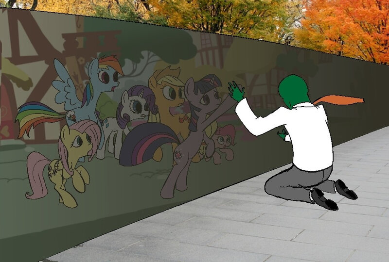 person at mural of ponies