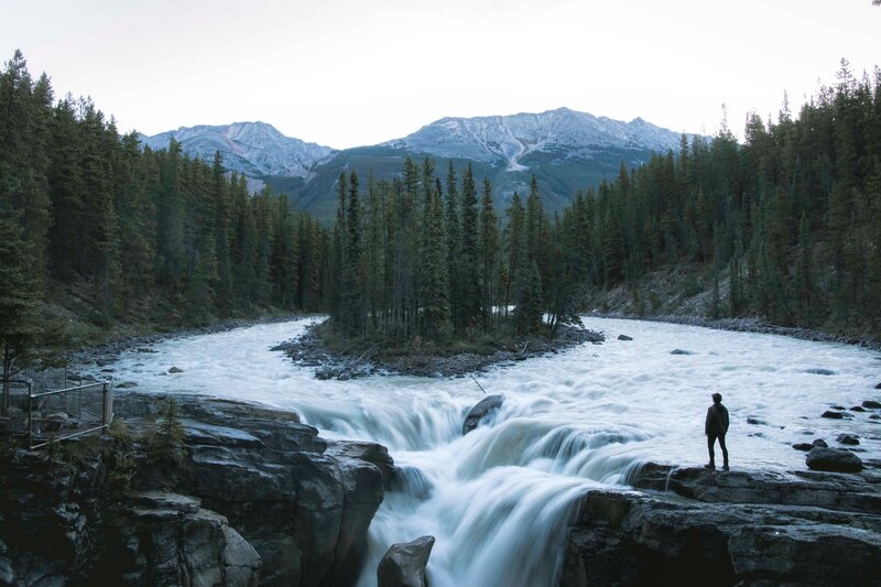 Person at River Waterfall — Blue