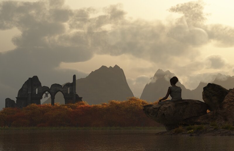 Person at ruins by lake