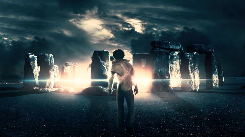person at stonehenge at night
