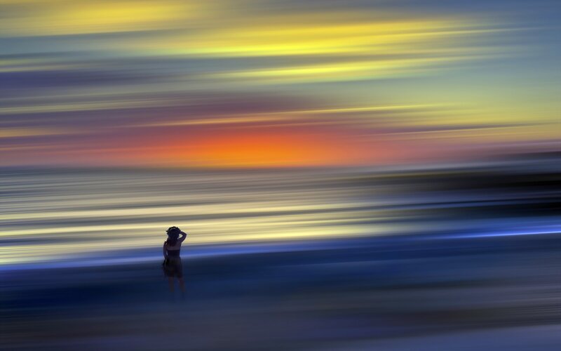 Person at sunset with motion blur