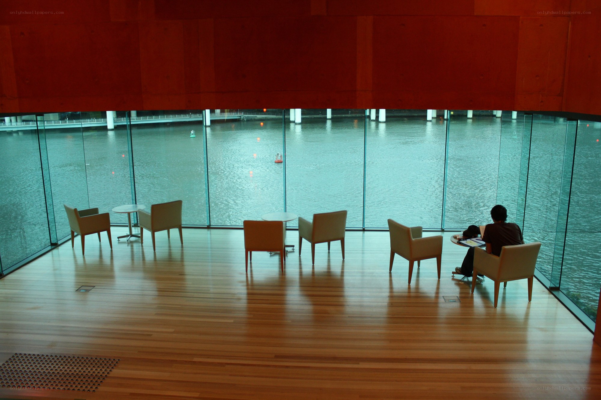 Person at table by water view