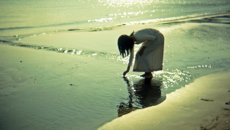 Person at the Water's Edge