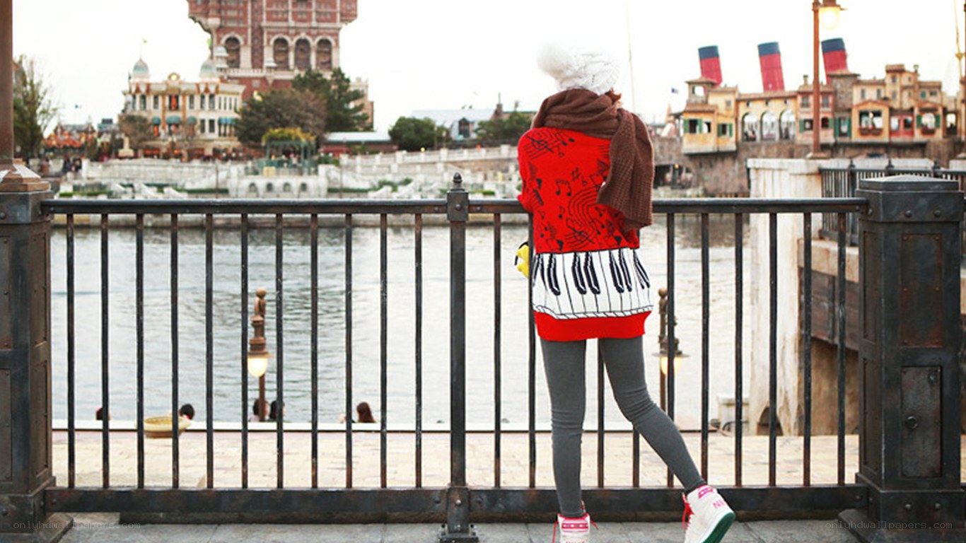 Person at theme park waterfront