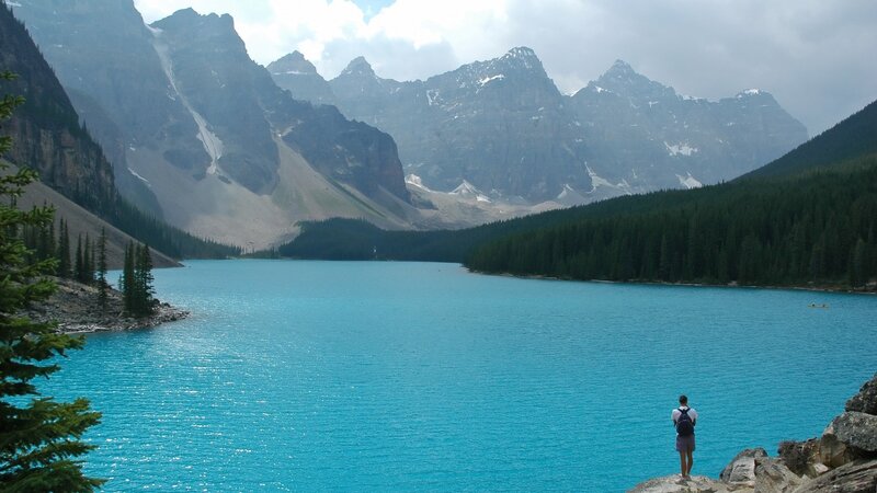person at turquoise lake