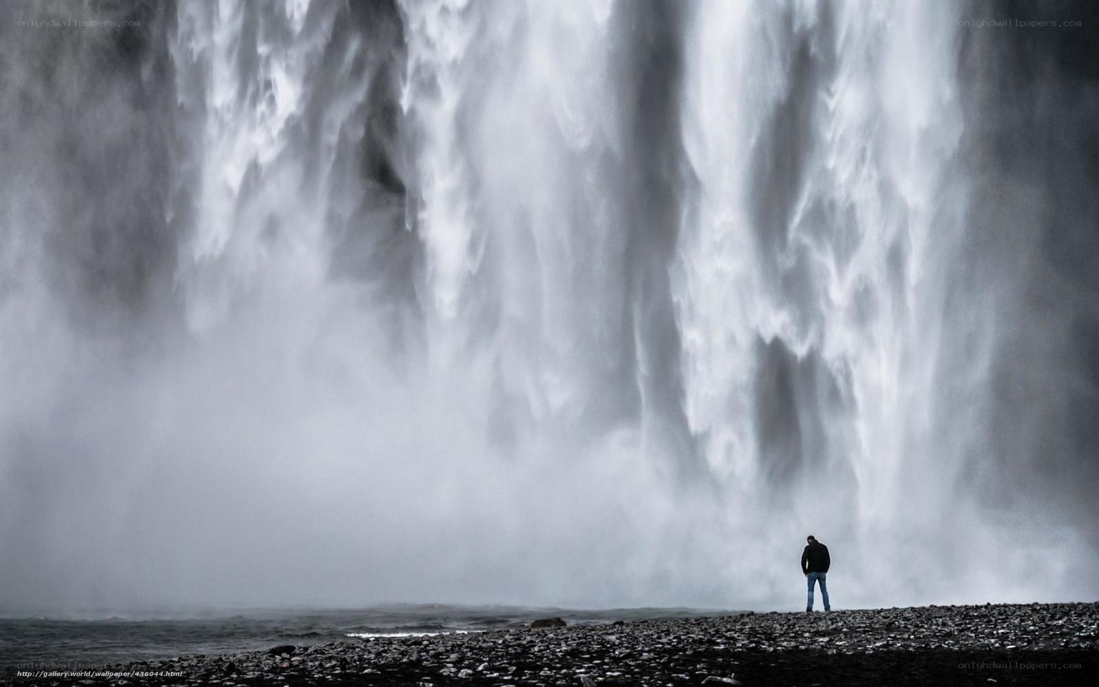 Person at waterfall base