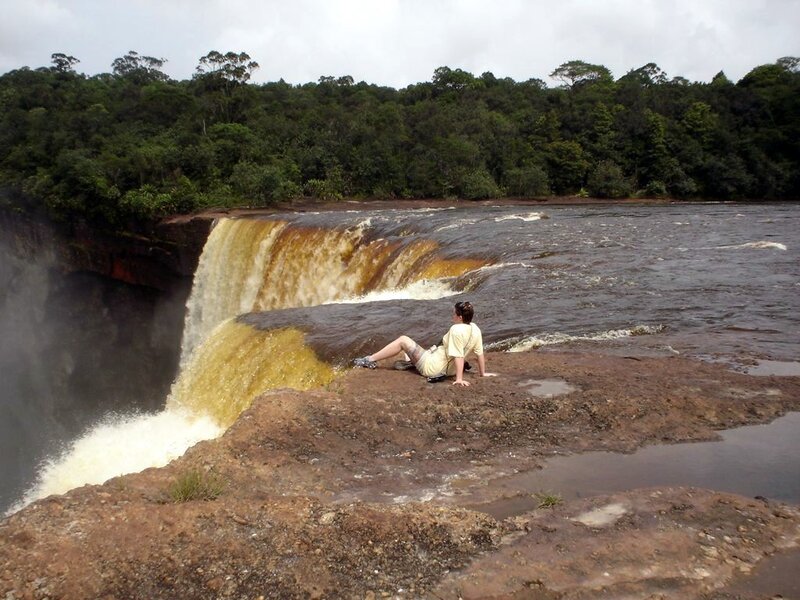 Person at Waterfall — Brown