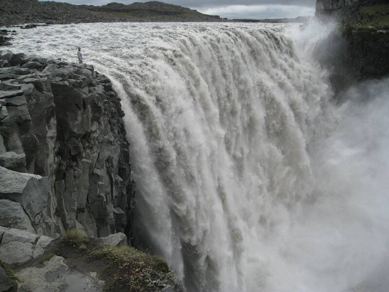 Person at Waterfall Edge — Gray
