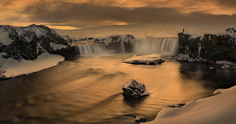 Person at Waterfall — Gold