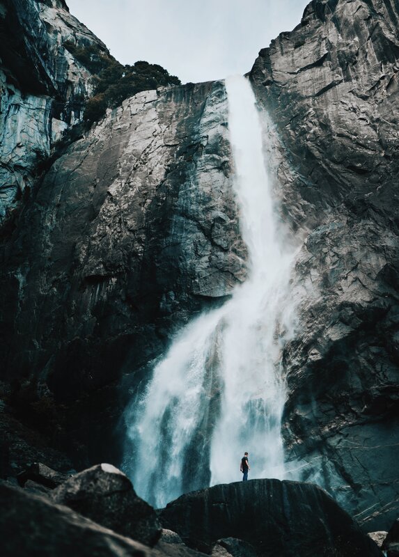 Person at Waterfall — Gray, Dramatic, Photograph, Cliff