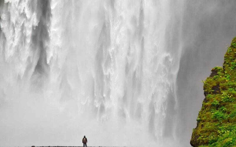 Person at Waterfall — White, Dramatic