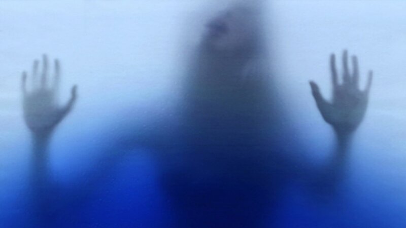 person behind frosted glass