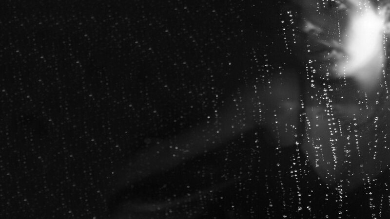 Person Behind Wet Glass — Black