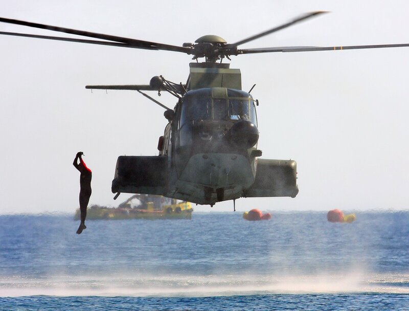 Person Being Lifted by Helicopter