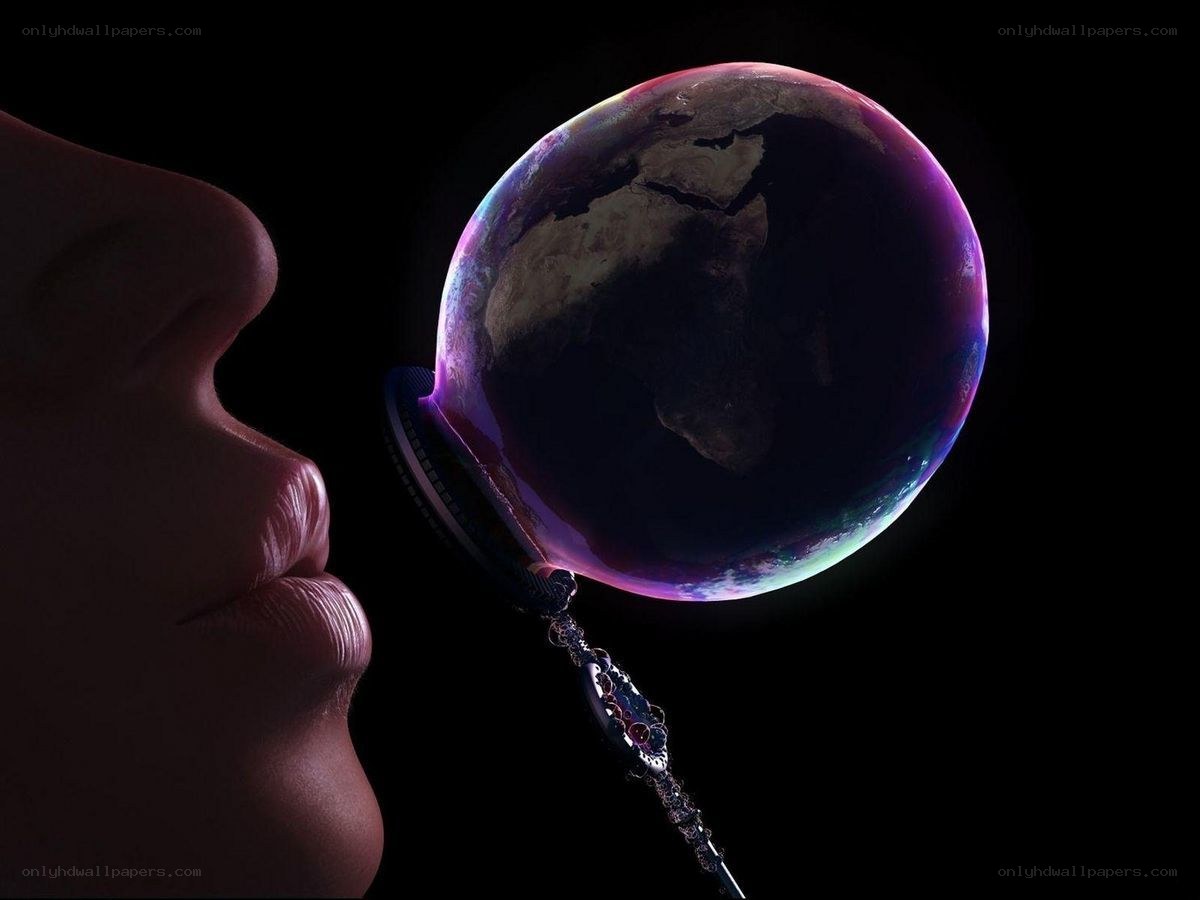 person blowing a bubble with earth inside
