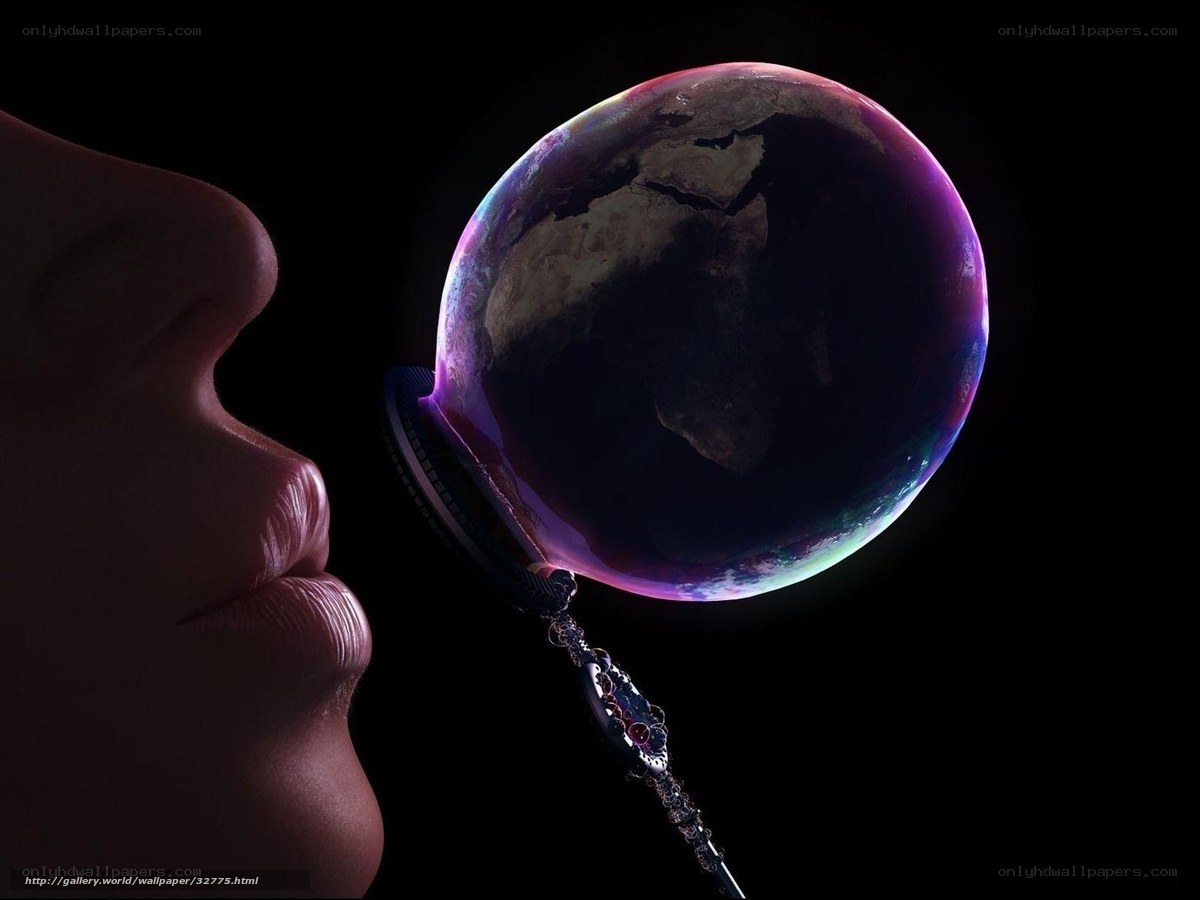 person blowing a bubble with earth inside