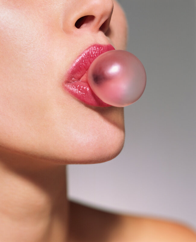 person blowing bubble gum