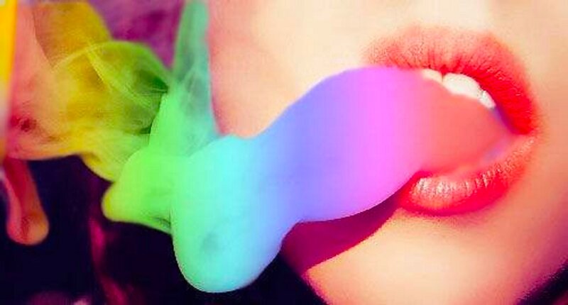 Person Blowing Colorful Smoke