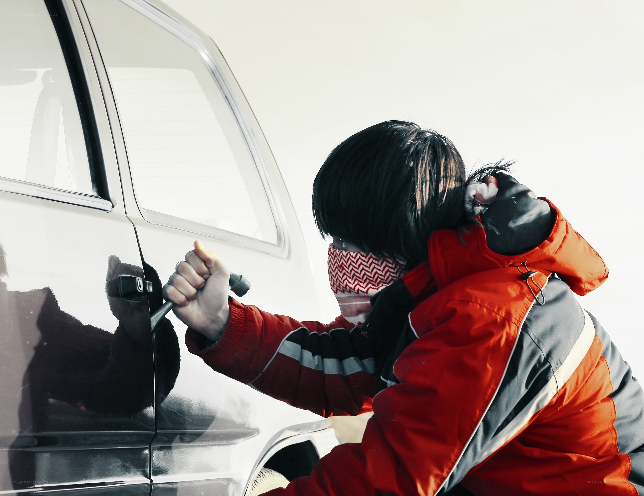 Person breaking into car