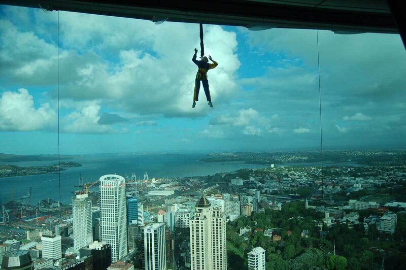Person bungee jumping from skyscraper