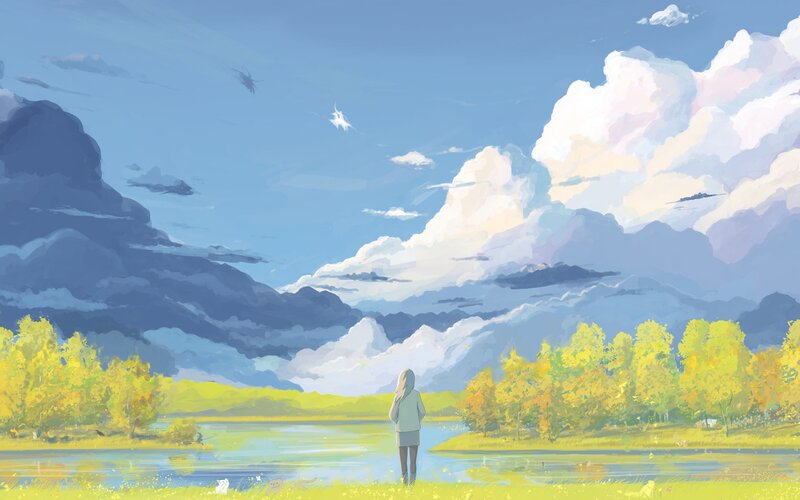 Person by a lake at sunset