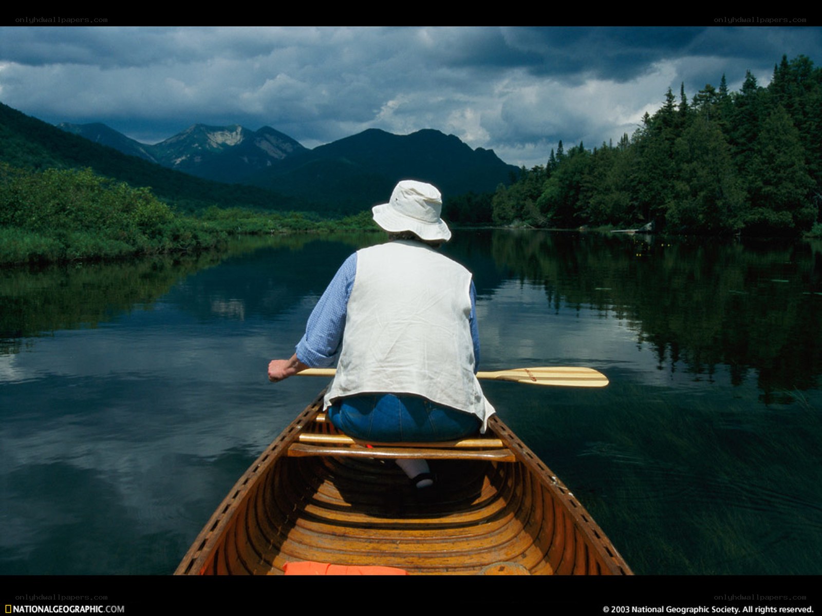 Person canoeing on a lake