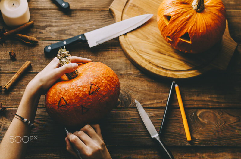 Person Carving Pumpkin