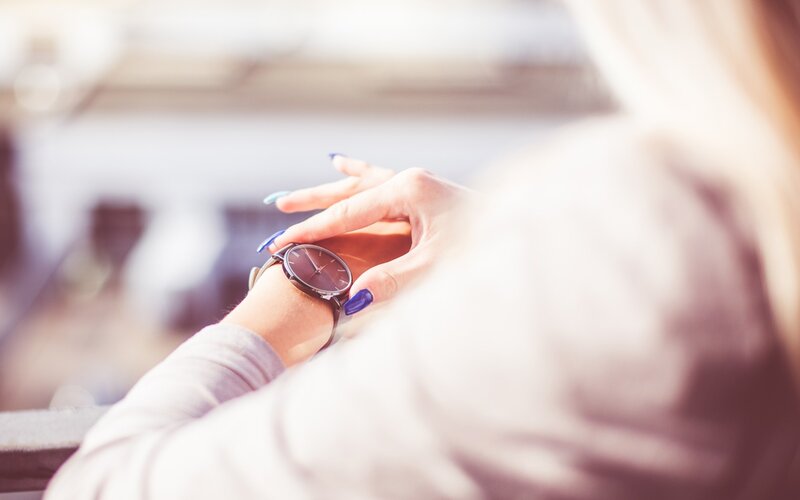 person checking watch