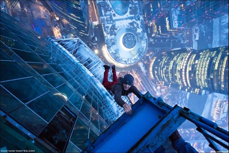 Person Climbing Skyscraper — Blue, Dramatic, Night