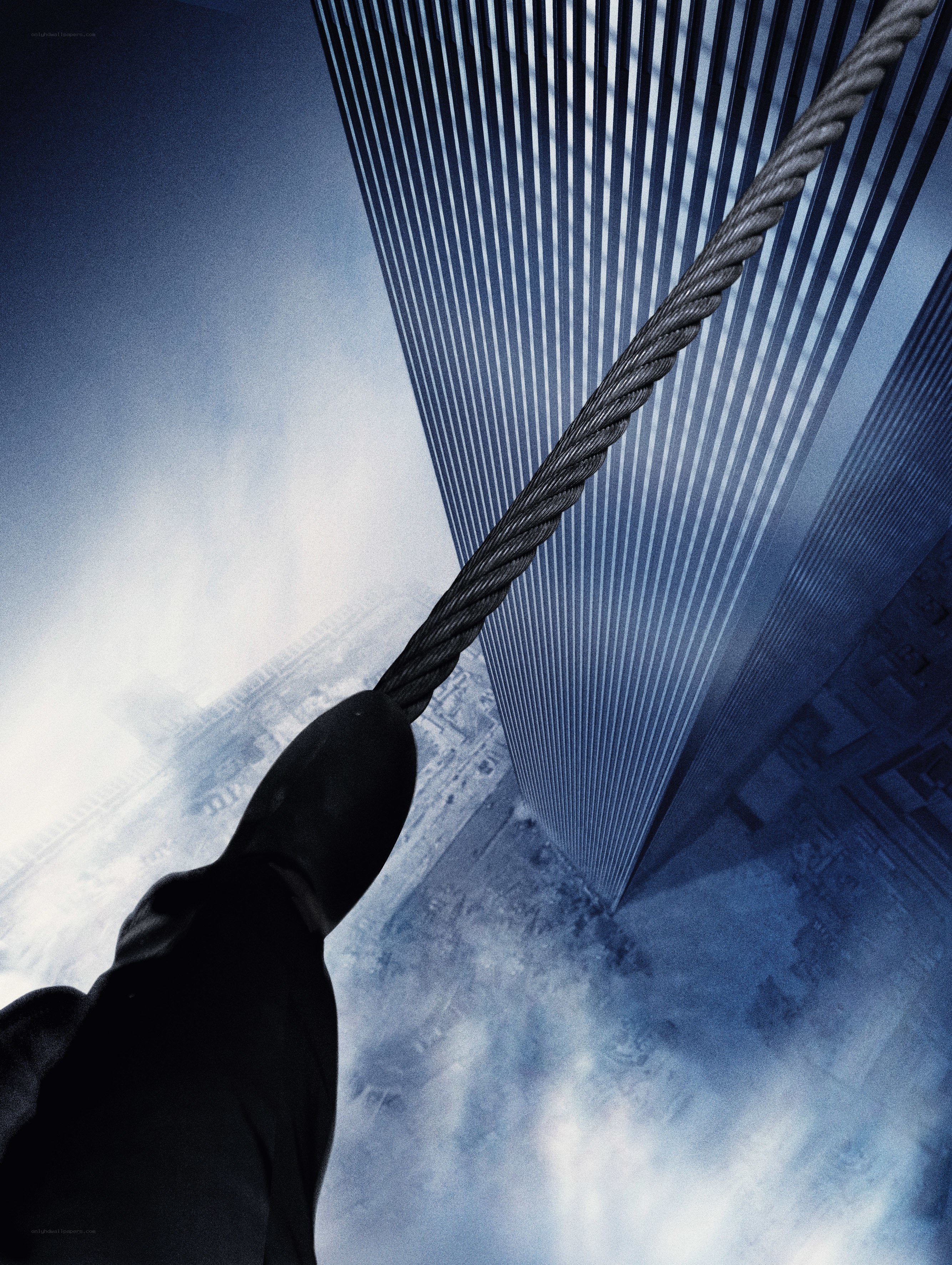 Person climbing skyscraper rope