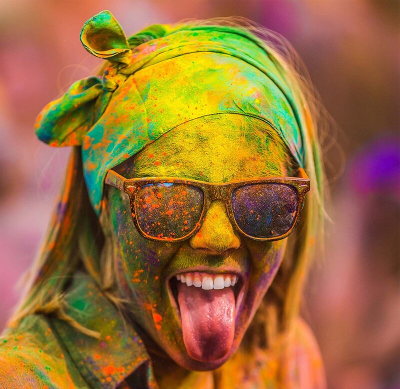 person covered in colorful powder