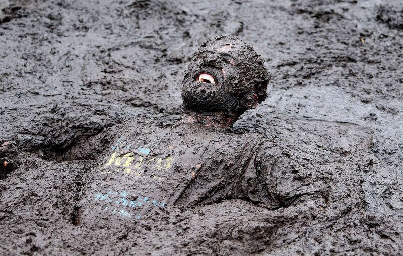 Person Covered in Mud