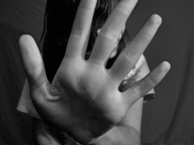Person Covering Face with Hand