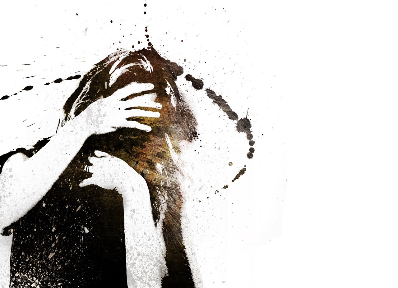 person covering face with hands