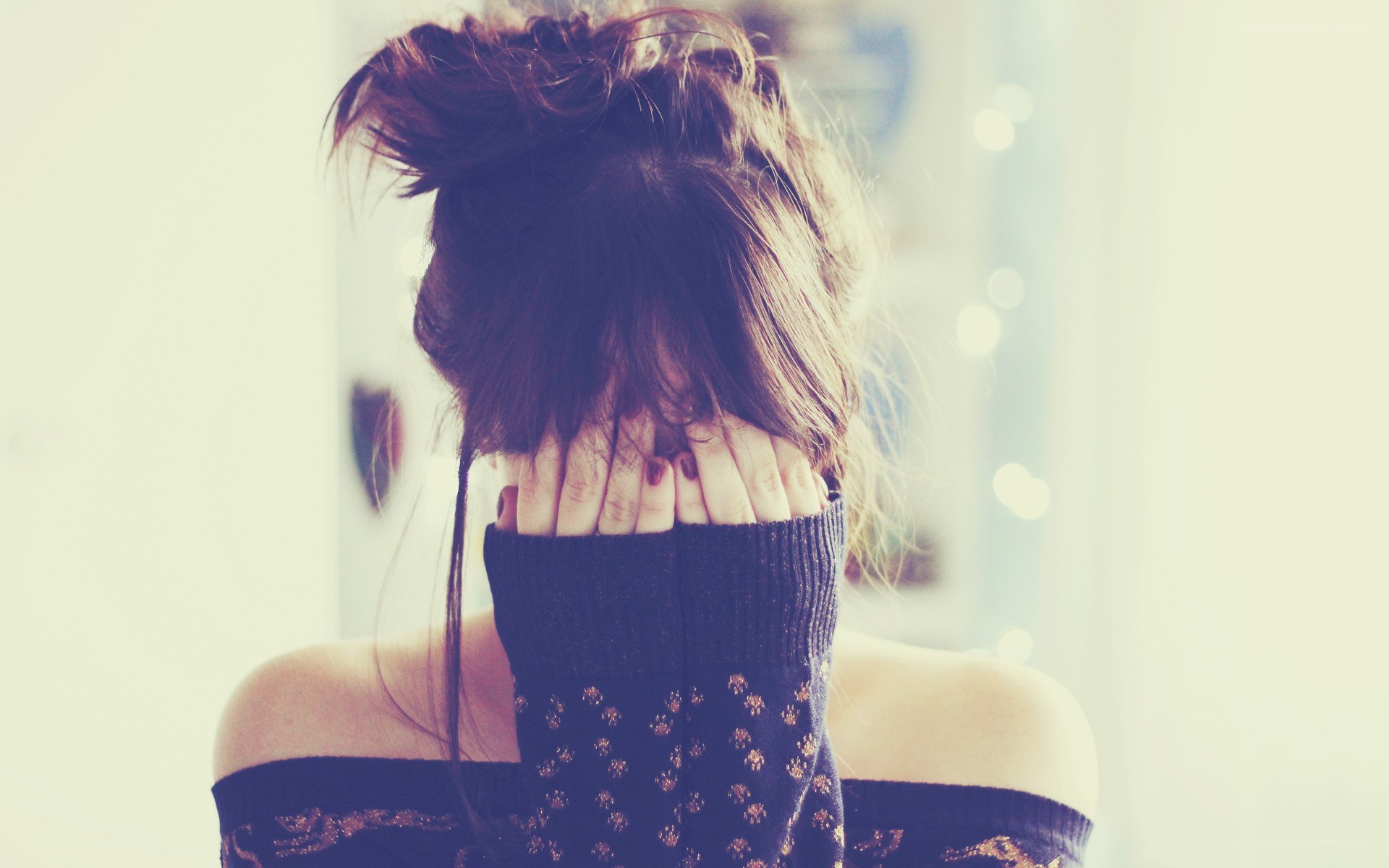 person covering face with hands