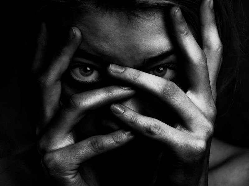 Person Covering Face with Hands — Black