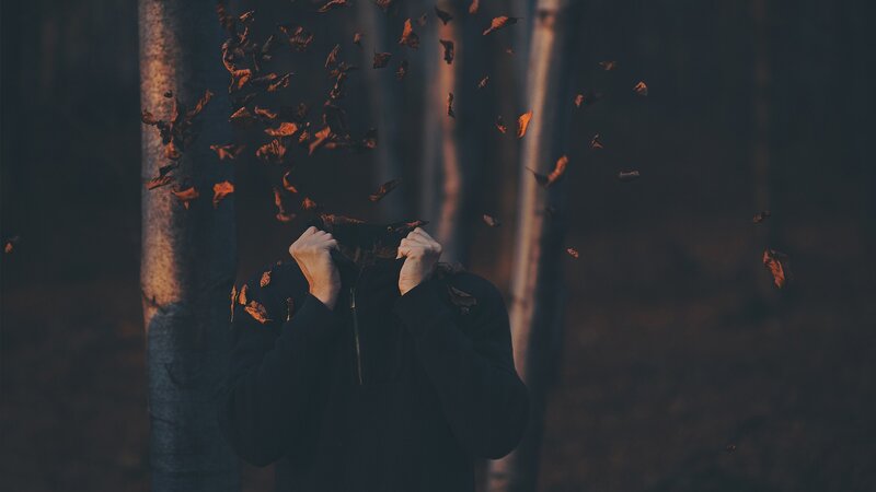 Person Covering Face with Hands — Brown
