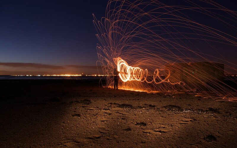Person Creating Light Trails — Orange