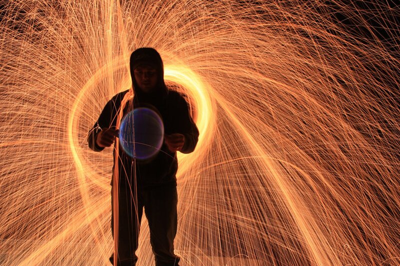 Person creating spark art
