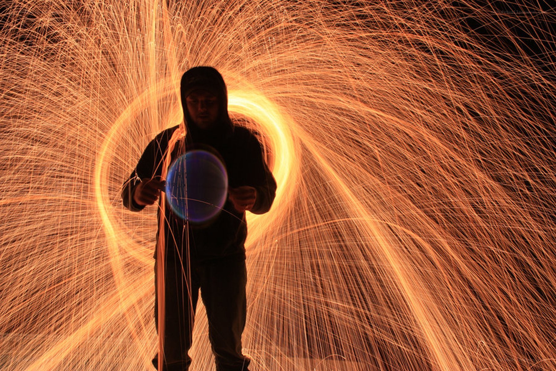Person creating spark art