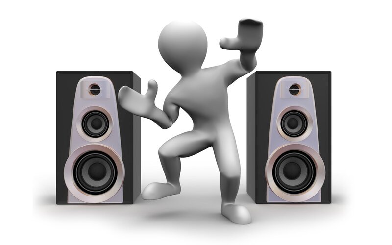 person dancing between speakers