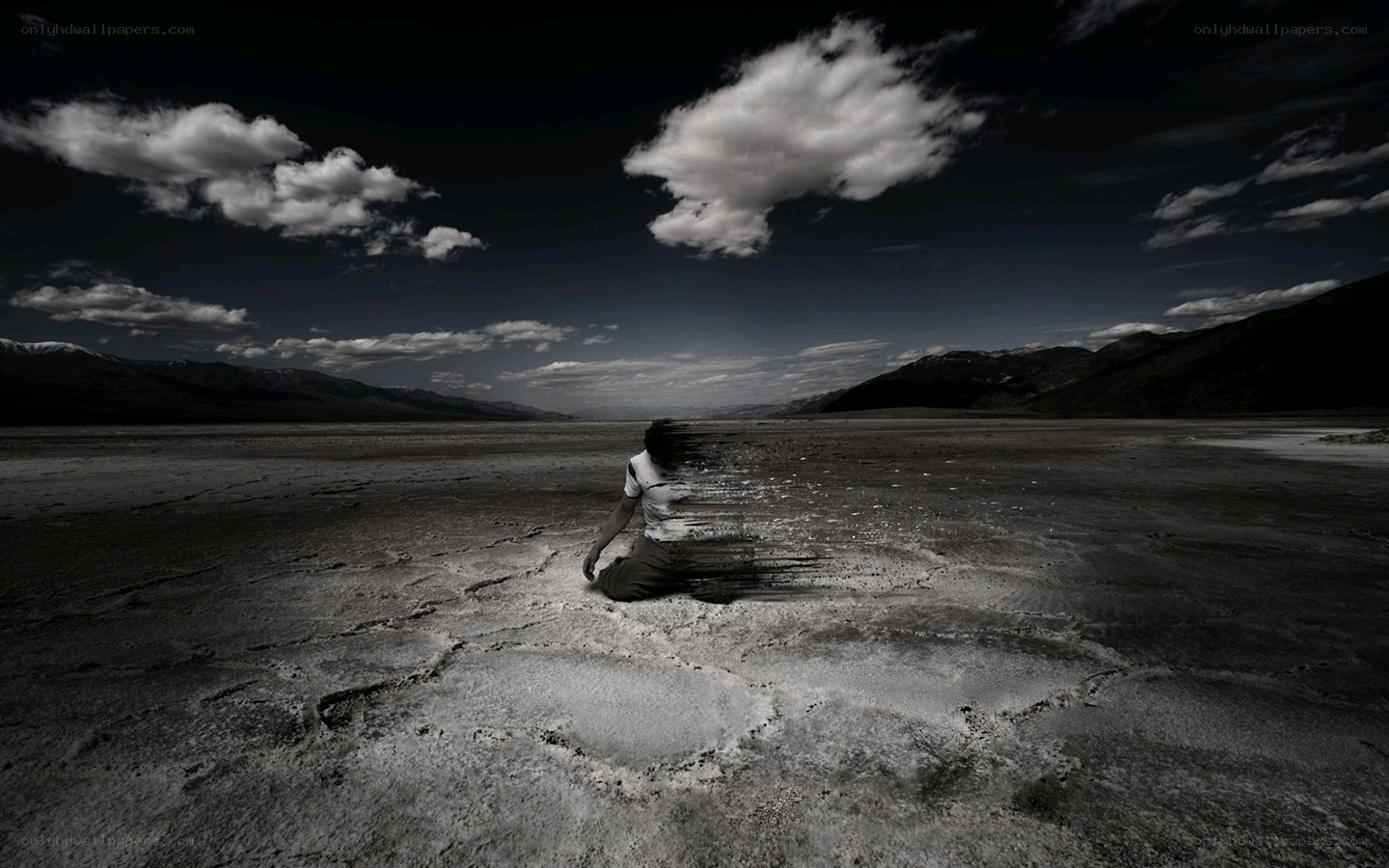 Person dissolving in desert